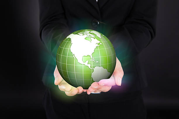 istock Businesswoman Holding Glowing Green Globe 514246049