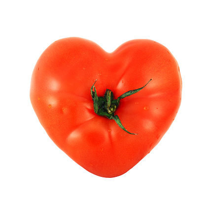 One tomato shaped like heart isolated on white background