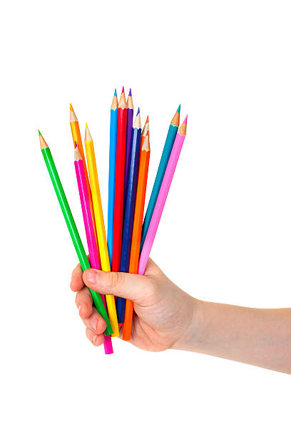 istock Child hand with bunch of pencils 514260178