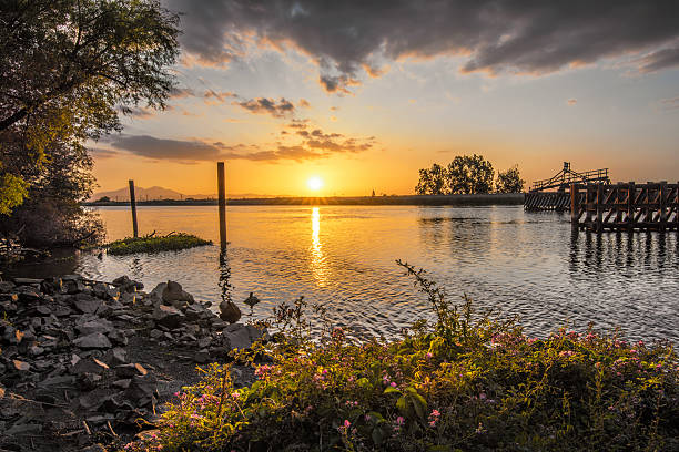 A sunset on the delta east of the San Francisco Bay Area in Discovery Bay, California. USA. Taken at sunset after a rain storm. This is a High Dynamic Range Image (HDRI). Nikon D810