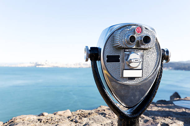 istock touristic telescope with blue sea 514261762