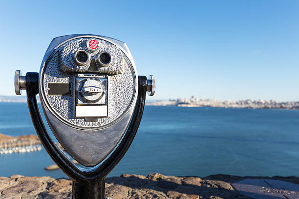 istock touristic telescope with blue sea 514261962