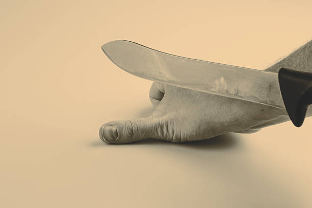 istock Close up of a suicidal man hand on isolated 514265174
