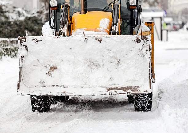 istock Tractor cleaning snow in city 514266294