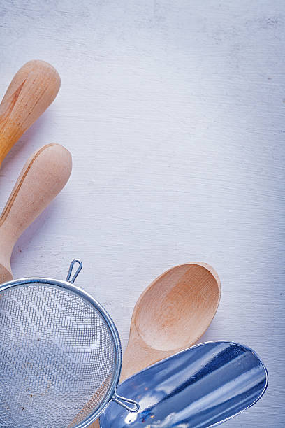 istock rolling pins sieve spoon scoop on white board 514266678