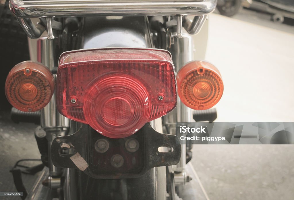 Motorcycle tail lights Old and dirty vintage motorcycle tail lights (tail lamp or rear lights), selective focus Brake Stock Photo