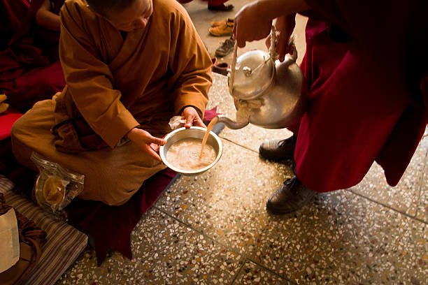 buddhist monks and refreshments, dalai lama temple, mcleod ganj, - losar bildbanksfoton och bilder