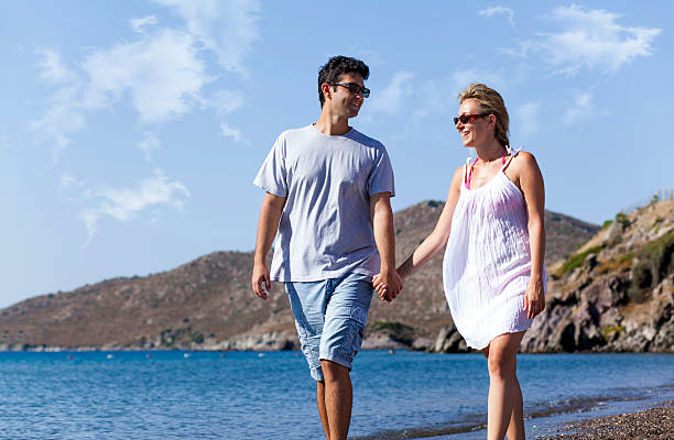 istock Young couple at the beach 514267603