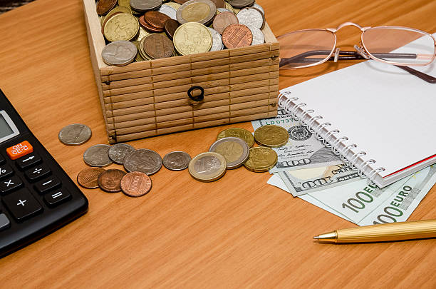 istock open treasure chest with coin. Us dollar and euro, notepad 514270338