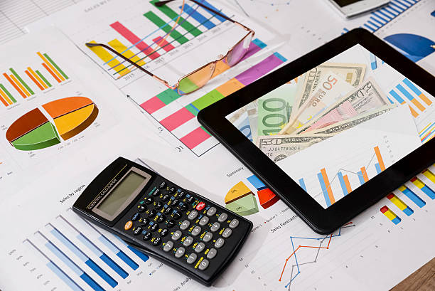 istock business workplace with tablet, smartphone and charts and graphs, pen 514270456