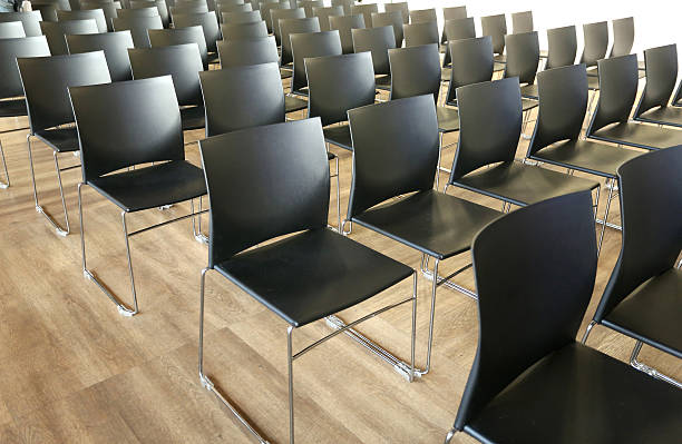 istock Rows of empty chairs prepared for an indoor event 514271126