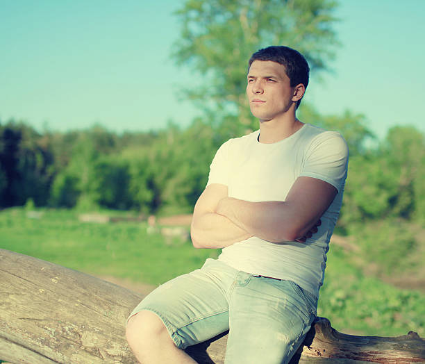 istock Handsome man relaxing on a nature, soft sunny sunset 514271837