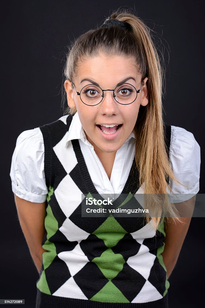 Nerd woman Young nerd woman crazy expression in glasses on black background Adult Stock Photo