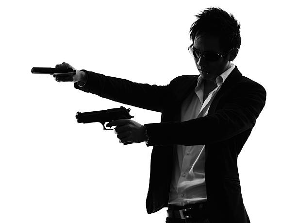 istock asian gunman killer  portrait shooting silhouette 514272503