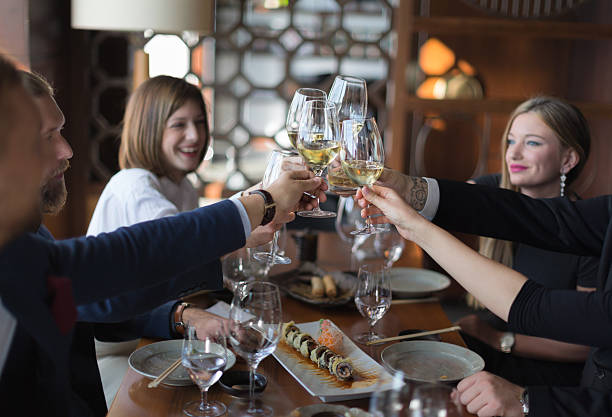 istock Friends toasting wine in restaurant 514272536