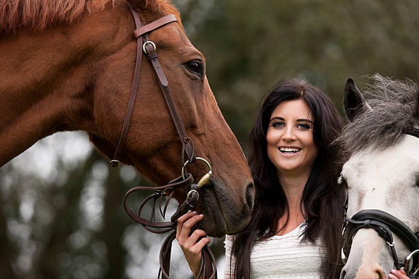 istock Beautiful woman and her horses 514272609