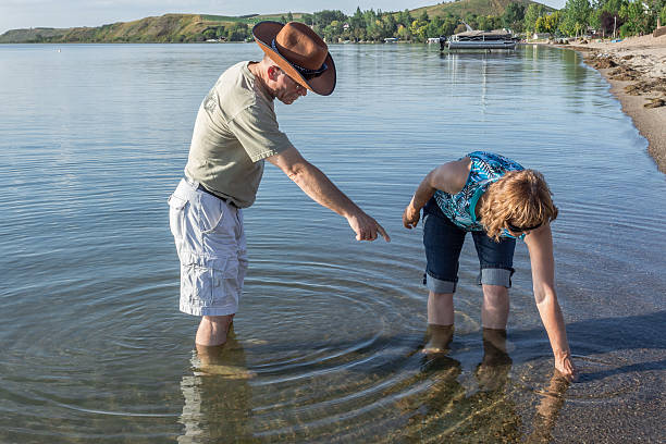 istock man and  woman standing in the water 514274945