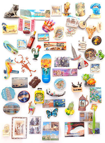 Szczecin, Poland - March 08, 2016: Souvenir magnets from all over the world on refrigerator. Magnets became popular travel gifts and collectible objects.