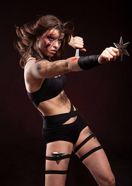 istock Killer woman with knife. Posing in studio. 514275092