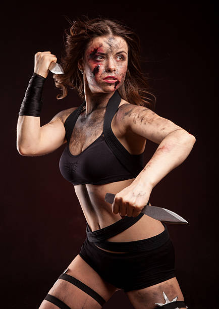 istock Killer woman with knife. Posing in studio. 514275100