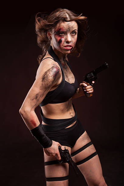 istock Killer woman with knife. Posing in studio. 514275102
