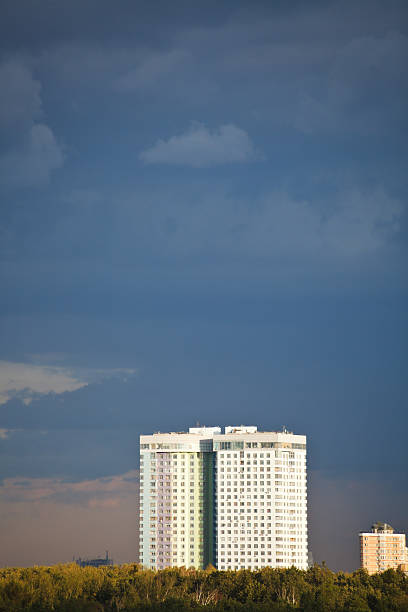 istock dark blue rainy clouds over apartment house 514275187