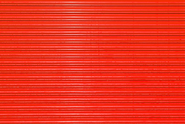 istock Red door shuttered roll up metal  red door 514276048
