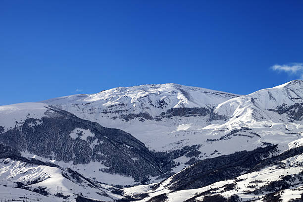istock Snowy sunlight mountains at sun morning 514277386