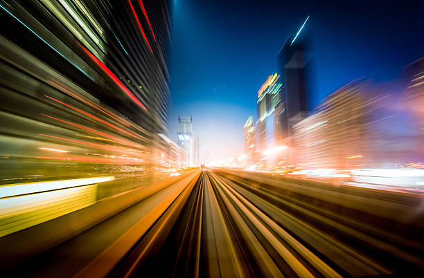 dubai velocità di movimento - night cityscape dubai long exposure foto e immagini stock