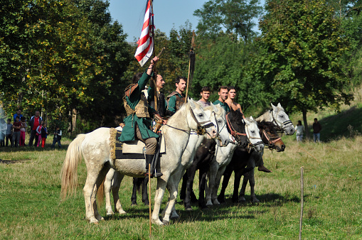 Cluj Napoca, Romania - October 3, 2015: Members of Eagles of Calata Nomadic group performing a free equestrian demonstration with Hunnic and archaic Hungarian costumes