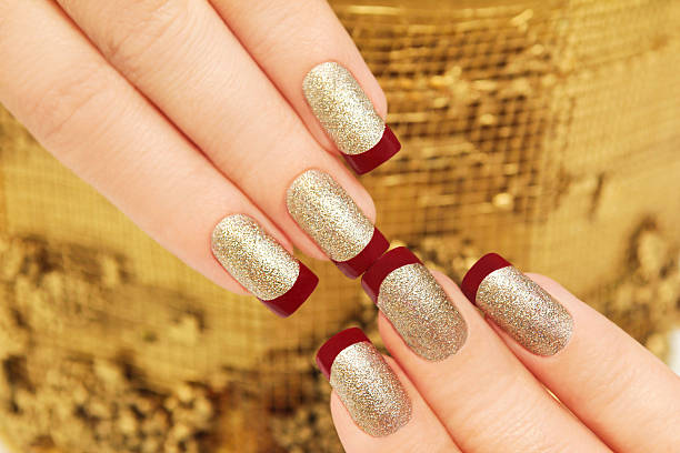 istock Golden maroon French manicure. 514281238