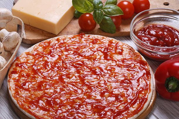 istock Basis for pizza with tomato sauce and ingredients 514294837