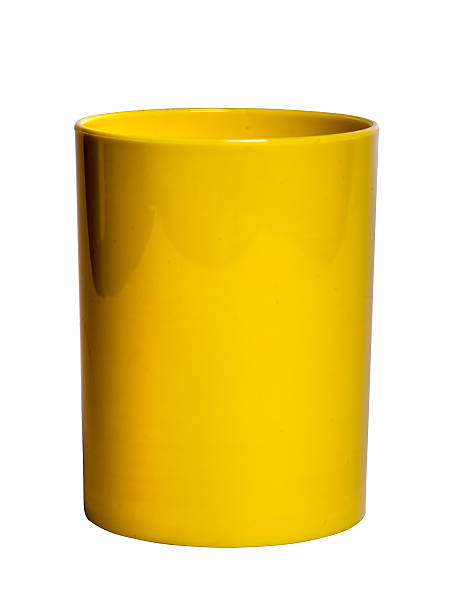 Yellow shiny Plastic cup for pencil - Stock Image stock photo