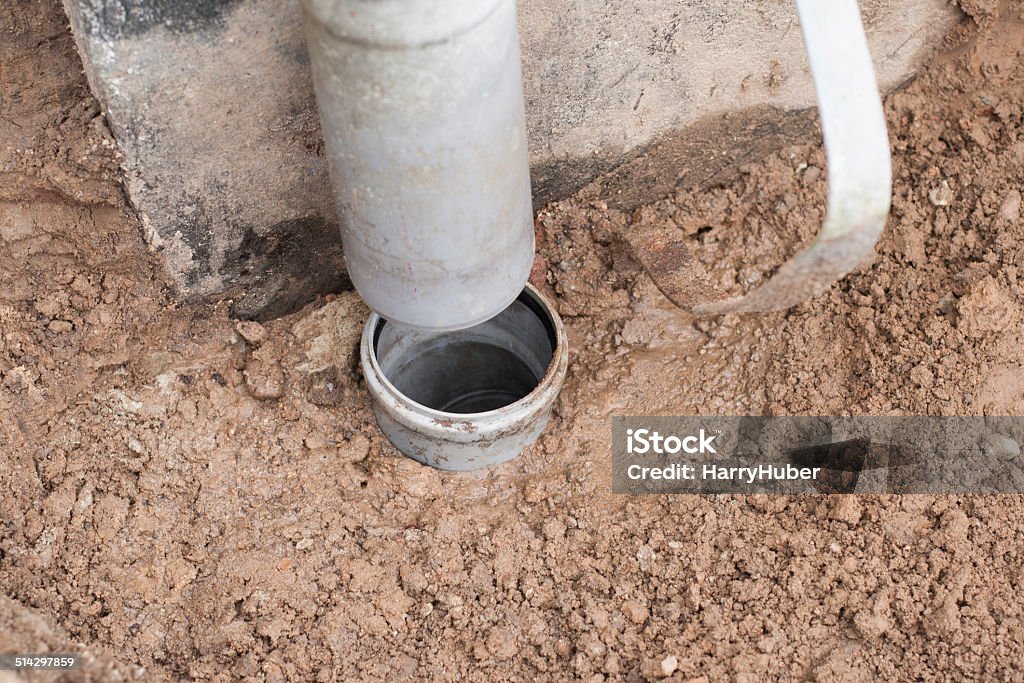 Down pipe Down pipe for roof drainage at a house wall with a gap Broken Stock Photo