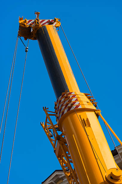istock Heavy Hydraulic Crane on Blue Sky 514299143