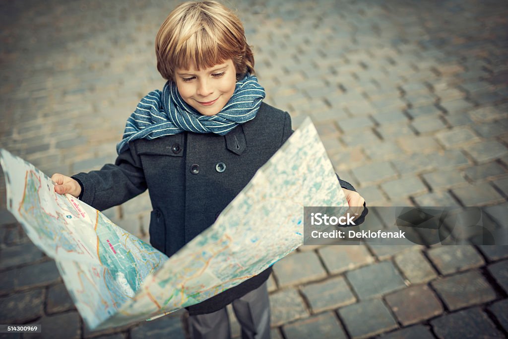 Tourist Little boy with a map Boys Stock Photo