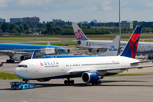 Schiphol, The Netherlands - June 22, 2014: Delta Airlines Boeing 767 taxiing on the airfield at Schiphol Airport near Amsterdam, The Netherlands.