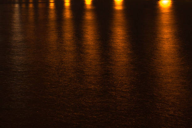 istock night landscape, sea, colored lights reflected in water 514301891