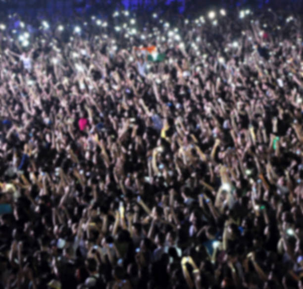 istock Blurred crowd of people partying 514310934