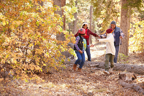 istock Grandparents With Children Walking Through Fall Woodland 514311730