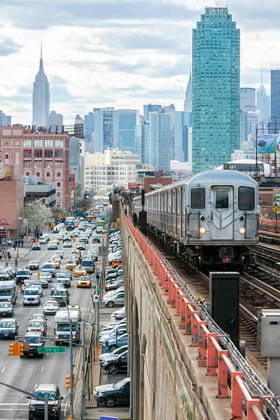 istock Subway Train Approaching  Elevated Subway Station in Queens, New York 514313178