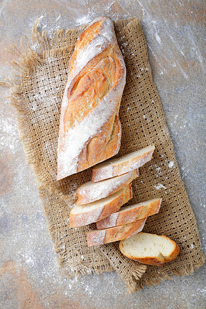 istock Sliced French Baguette on the sackcloth 514313888
