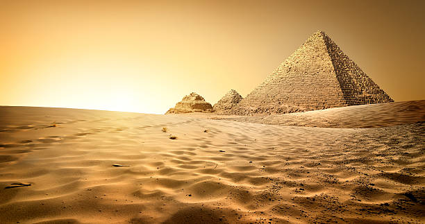 Pyramids in sand Egyptian pyramids in sand desert and clear sky pyramid photos stock pictures, royalty-free photos & images