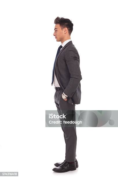 Side View Of A Young Business Man Standing In Line Stock Photo - Download Image Now - Profile View, Men, Full Length