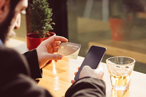 istock Man in a cafe with credit card 514317470