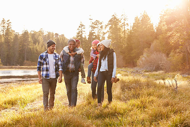 istock Extended Family Group Walking By Lake 514318022