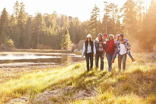 Photo of Extended Family Group Walking By Lake