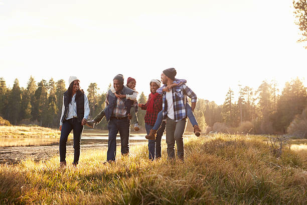 istock Extended Family Group Walking By Lake 514318178