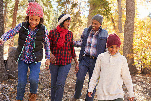 istock Grandparents With Children Walking Through Fall Woodland 514318436