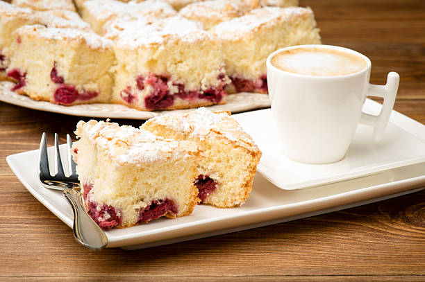 istock Piece of biscuit with cherry and a cup of coffee. 514319370